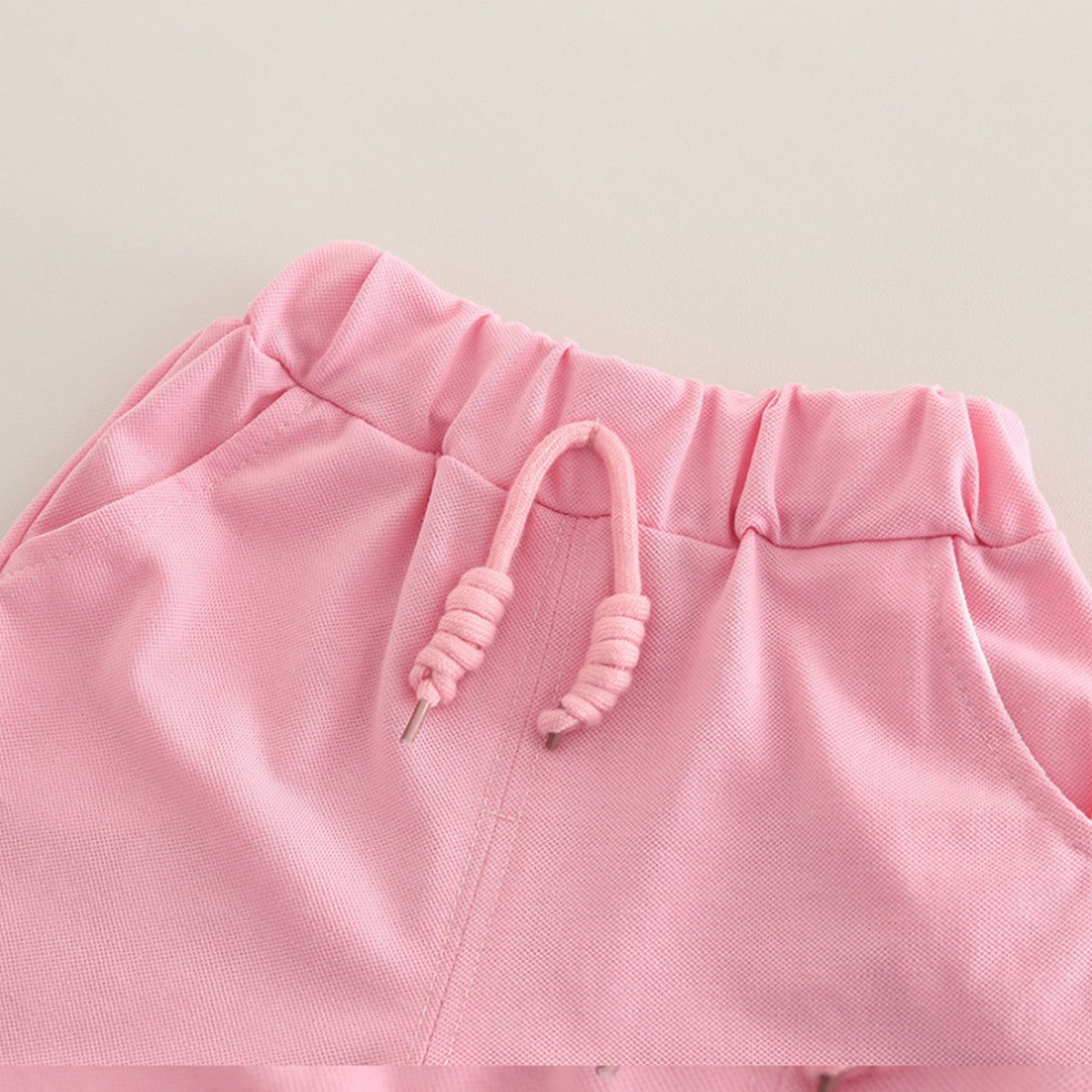 1-6 Yaş Pembe Cebinde Figürlü Polo Yaka Şort Takımı – Unisex